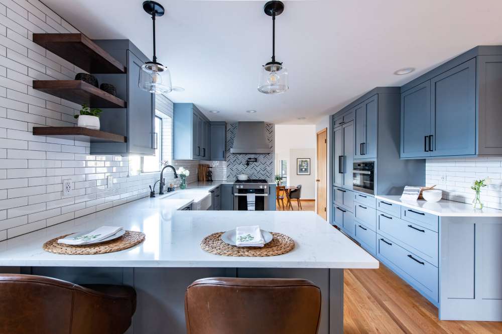 grey kitchen cabinets with stainless steel appliances
